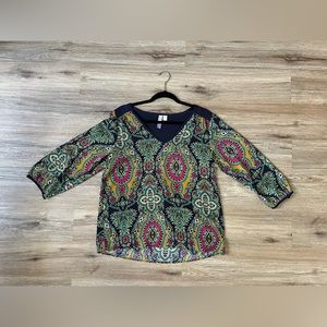 Size is Medium. V neckline blouse with the colors of a pink, orange, and blues